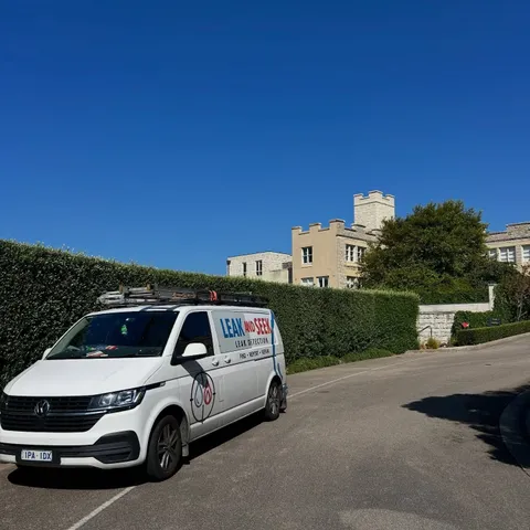 Leak and Seek van on a residential driveway