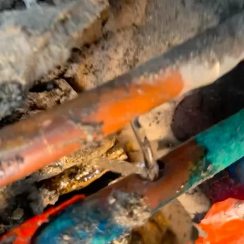 Close-up of a corroded pipe joint