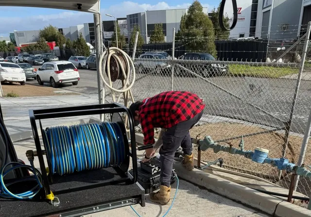 Leak and Seek technician using specialised leak detection equipment on site in Melbourne